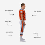 Back view of orange youth football uniform showing back number placement and navy side panels tapering to hem with matching white pant stripe