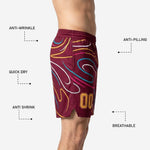 Close detail of full-dye sublimation on maroon basketball shorts showing gold, teal, pink, and white swirl lines bonded into polyester