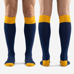 Full pair of over-the-calf blue and gold custom soccer socks with matching heel and toe cap in Athletic Gold