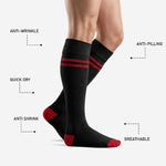 Over-the-calf red and black soccer socks showing red contrast toe and heel construction detail