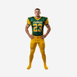 Personalized American football uniforms in forest green and gold, front view showing team name, front number, and V-neck jersey with matching gold pants