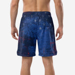 Right side view of navy and red team basketball shorts showing the all-over sublimated grunge texture and hem side split for range of motion