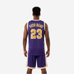 Personalized basketball uniform kit detail showing gold and white crew neckline trim and panel construction
