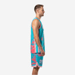 Personalized basketball uniforms teal coral, left side view showing stripe panel and mesh jersey