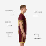 Personalized men's soccer uniform in maroon with gold trim shorts featuring geometric border pattern