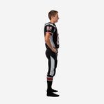 Side view of red and black youth football uniform showing silver shoulder panel, red sleeve cuff trim, and wide silver side panel on matching black football pants