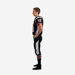 Left side view of sublimated youth football uniform set showing black pants with silver outer leg panel running from hip to below the knee