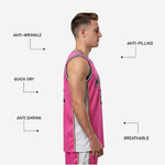 Back view of custom pink basketball jersey designs showing player name and back number in navy and gold on the pink body panel with white side panels