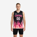 Custom pink basketball jersey designs with black upper chest and full-wrap hot pink flame pattern rising from white hem, front and back view on male model