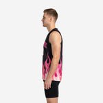 Left side view of pink basketball jersey designs showing continuous flame sublimation pattern wrapping from front hem across the side panel