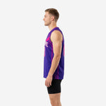 Reverse side view of purple and magenta sublimated basketball jersey showing continuous halftone pattern wrapping around side panel to back