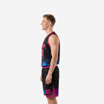 Opposite side view of black and hot pink basketball jersey and shorts showing sublimated neon splash design and drawcord waistband