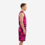Men's custom pink basketball uniform front view showing digital camo jersey with team name arc, front number 00, and matching camo shorts with purple waistband