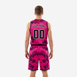 Reverse side view of custom pink basketball uniform set showing digital camo pattern continuity across jersey and shorts with deep purple trim