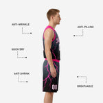 Back view of black and pink basketball uniforms showing player name and number placement on jersey and matching shorts