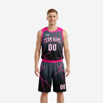 Pink basketball uniforms with black lightning bolt pattern, custom team name and number 00 on jersey and matching shorts, front view