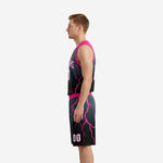 Right side view of pink basketball uniforms displaying lightning bolt sublimation print across jersey and shorts