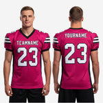 Close-up detail of 3-stripe black and white shoulder panel on pink custom American football jersey showing sublimation print quality