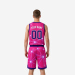 Pink and purple reversible basketball uniform alternate side view showing contrast trim, drawcord waistband, and full-field geometric print