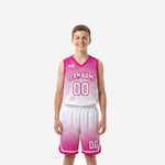 Pink youth basketball uniforms with halftone dot fade pattern, showing jersey front and matching shorts as a full custom 2-piece set