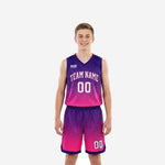 Custom pink youth basketball uniforms with purple gradient fade and hex-dot texture, team name arced on chest and number 00 front and back, full set front view