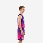 Custom pink youth basketball uniforms purple gradient jersey with white arced team name and number 00 on matching pink and purple shorts, front view
