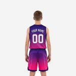 Right-side view of custom pink and purple youth basketball uniform set with matching gradient jersey and shorts hem band detail