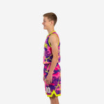Side view of custom pink and purple camo youth basketball uniform set with yellow trim at armhole and shorts hem