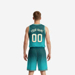 Opposite side view of gradient teal basketball jersey and shorts set displaying armhole binding and side vent construction on the matching shorts
