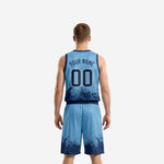 Right side view of custom carolina blue basketball uniforms showing armhole binding and shorts drawcord waistband detail