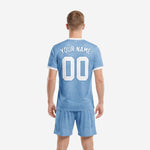 Close detail of powder blue custom soccer jersey with marble-texture sublimation print and white crew neck collar trim