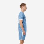 Side view of powder blue plain soccer uniforms with white side stripe on shorts and white cuff trim on short sleeve jersey