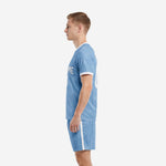 Right-side view of custom plain soccer uniforms in powder blue showing white contrast collar trim and matching shorts with side stripe
