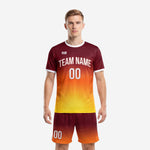 Professional soccer team uniforms in maroon to orange to yellow gradient full-dye sublimation, front view, mens full kit with matching shorts