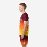 Professional soccer team uniform right side profile in maroon, athletic orange, and canary yellow gradient with white crew neck and cuff trim