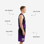 Detail view of black and purple basketball shorts showing gradient colorway, elastic waistband, and player number 00 on lower left leg