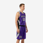 Adult male wearing purple and black basketball uniform set with silver curved side panels on jersey and matching shorts, angled side view showing panel detail