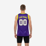 Opposite side view of custom purple and gold basketball jersey showing solid purple body and yellow binding detail at armhole and neckline