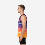 Side view of purple and gold basketball jersey showing coral armhole binding and full gradient from purple shoulder to gold hem