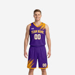 Purple and gold reversible basketball uniforms front view showing purple side with diagonal gold brush-stroke pattern, arced team name, and front number 00 on jersey and matching shorts