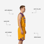 Close detail of sublimated diagonal brush-stroke pattern on purple reversible basketball jersey shoulder and chest with gold arced team name lettering