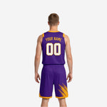 Side view of purple and gold reversible basketball uniform showing V-neck collar trim, armhole binding, and side panel construction on the purple face