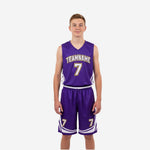 Purple and gold youth basketball uniforms full set front view showing arced team name and number 7 on purple V-neck jersey with white chevron shorts