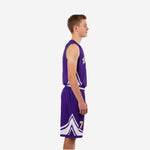 Side view of purple and gold youth basketball uniform showing white geometric side panel on jersey and double chevron hem detail on purple shorts