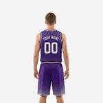 Opposite side view of purple sublimated basketball uniform with halftone diamond pattern on shorts and grey hem trim