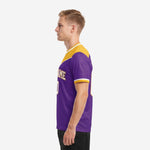 Right side view of men's purple and gold custom soccer jersey displaying sublimated chevron panel and white sleeve cuff detail