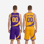 Full set detail of purple and gold reversible basketball uniforms showing jersey and shorts diagonal swoosh stripe alignment