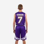 Back view of purple and gold custom youth basketball uniform showing player name and number placement on purple jersey with white trim