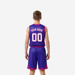 Opposite side view of purple and pink custom youth basketball uniform showing side panel detail on shorts and jersey