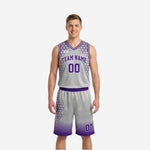Silver and purple side of the reversible basketball uniform showing gray jersey with purple hexagon pattern, purple team name, and gradient shorts